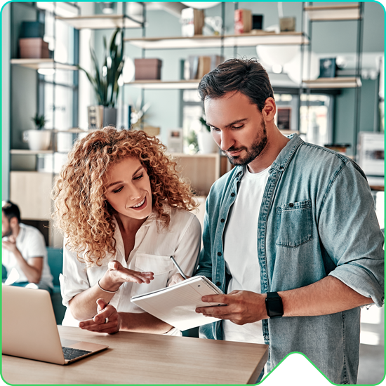 man and woman looking at a notepad